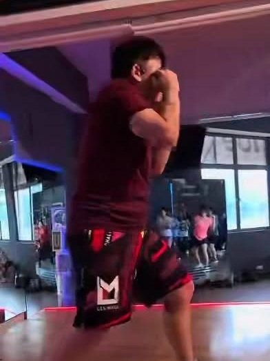 Dr. Steven Goh teaching Body Combat at Tip Tap Toe — upper-body action shot